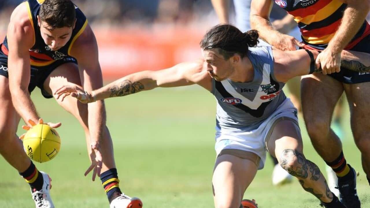 Jasper Pittard and Rory Atkins compete for the ball