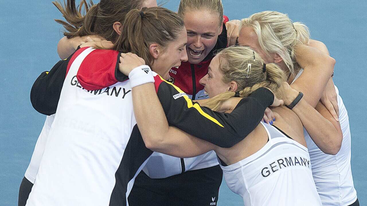 Germany's Angelique Kerber (right) reacts with team mates