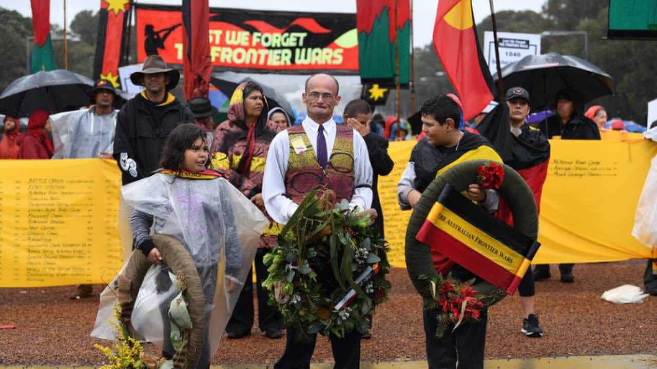 Members of the Frontier war contingent prepare to lay a wreath at the stone of remembrance at the Australian War Memorial in Canberra, April 25, 2017 (AAP)