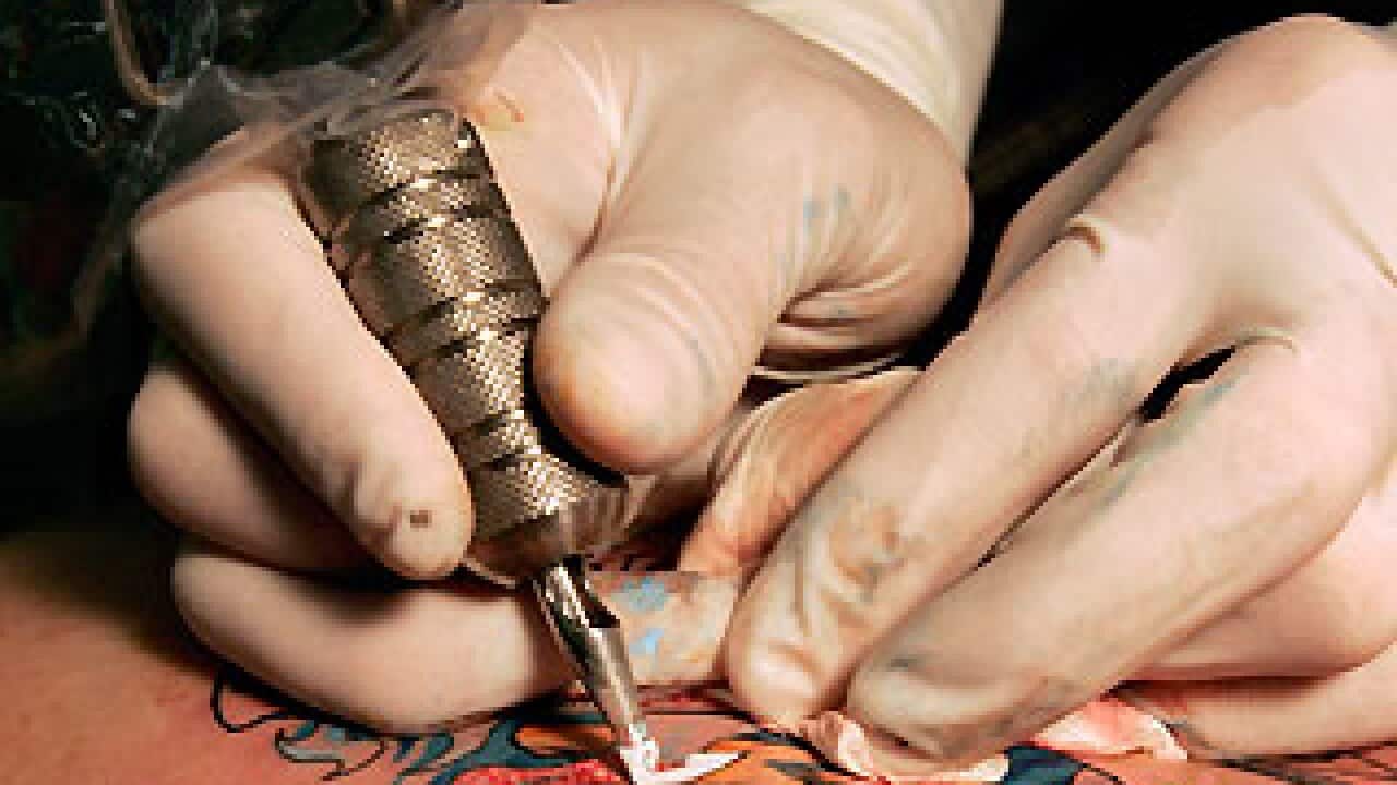 Tattoo artist at work