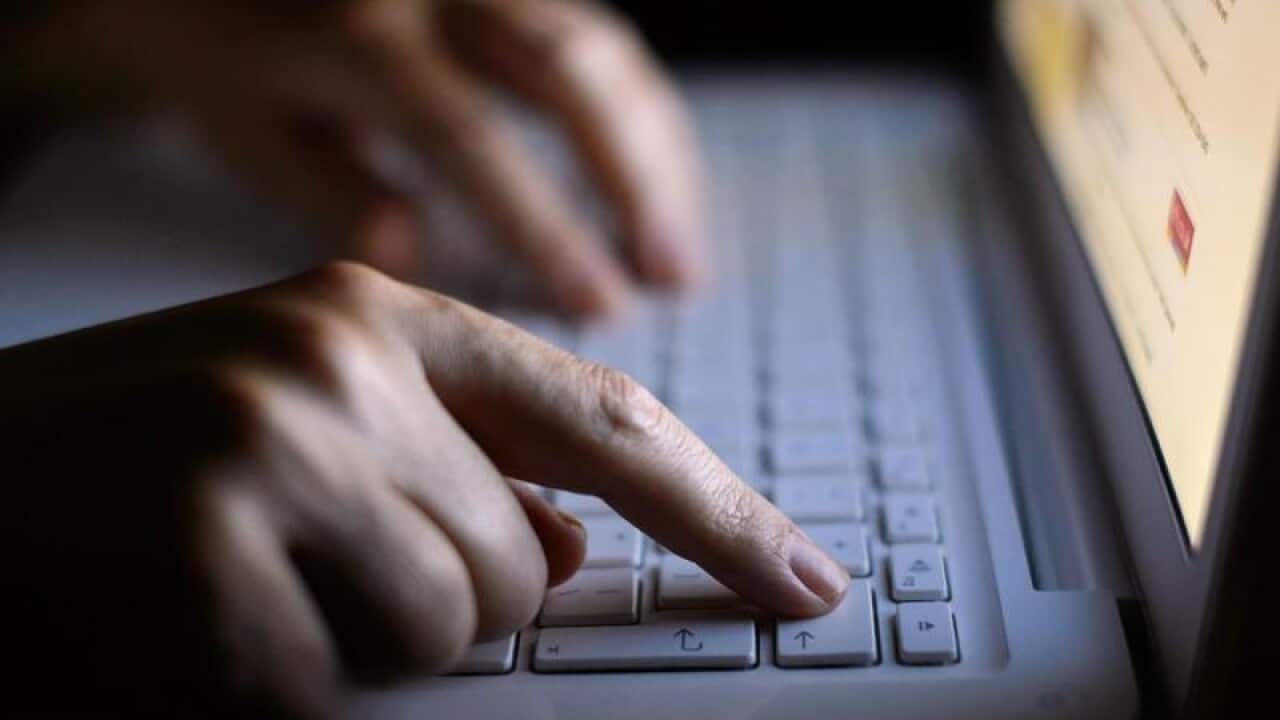 File photo of a woman using a laptop.