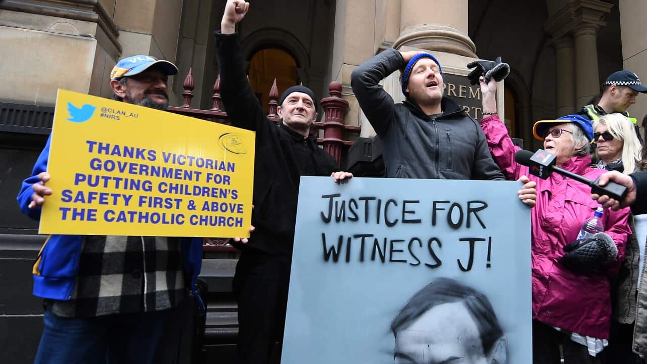 Supporters of abuse victims are seen outside the Supreme Court of Victoria, Melbourne.