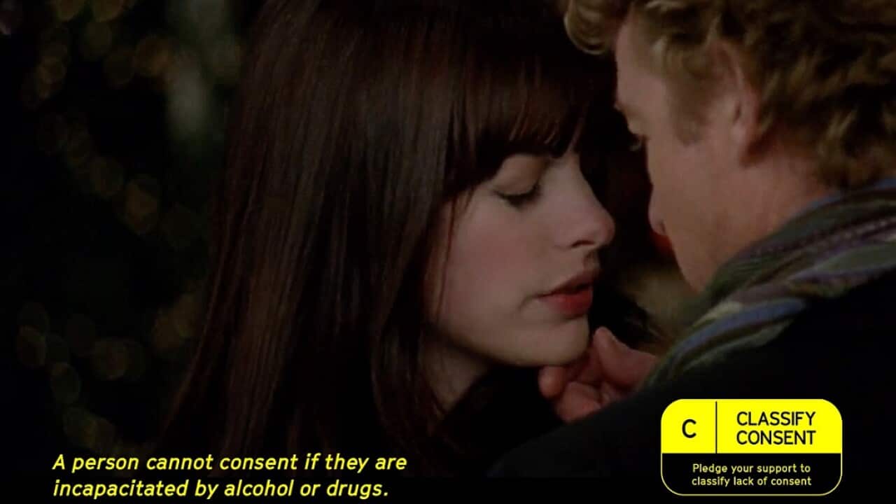 A woman and a man standing close together and facing each other