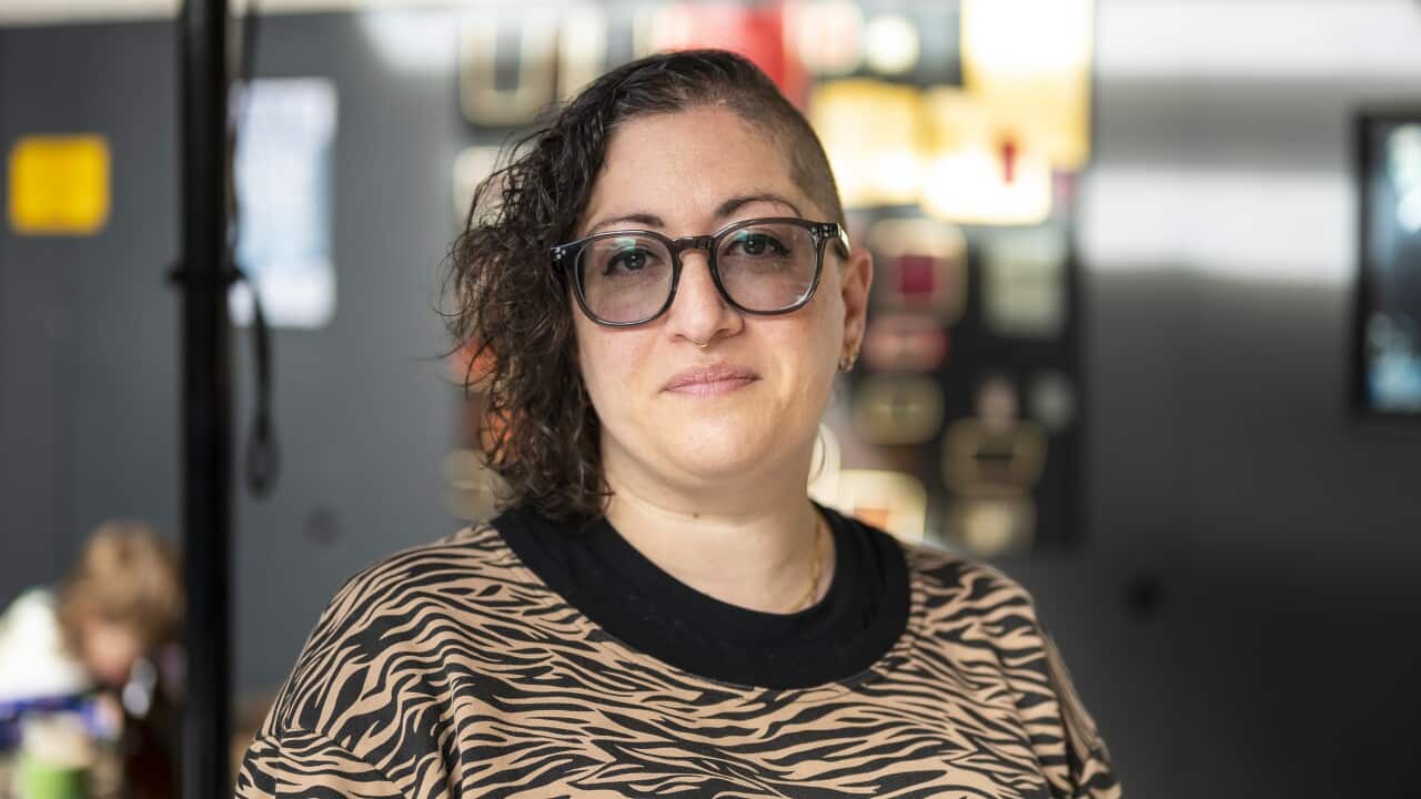 A woman wearing glasses.