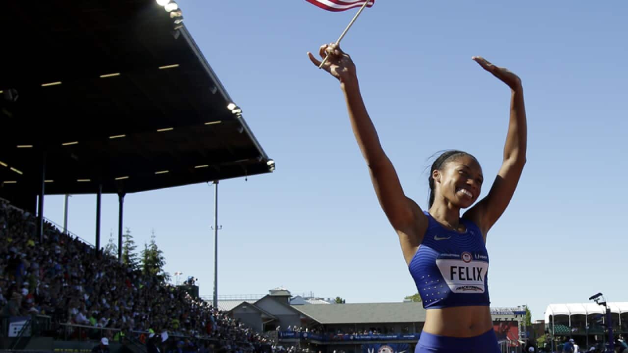 Allyson Felix waves after winning the women's 400-meter final