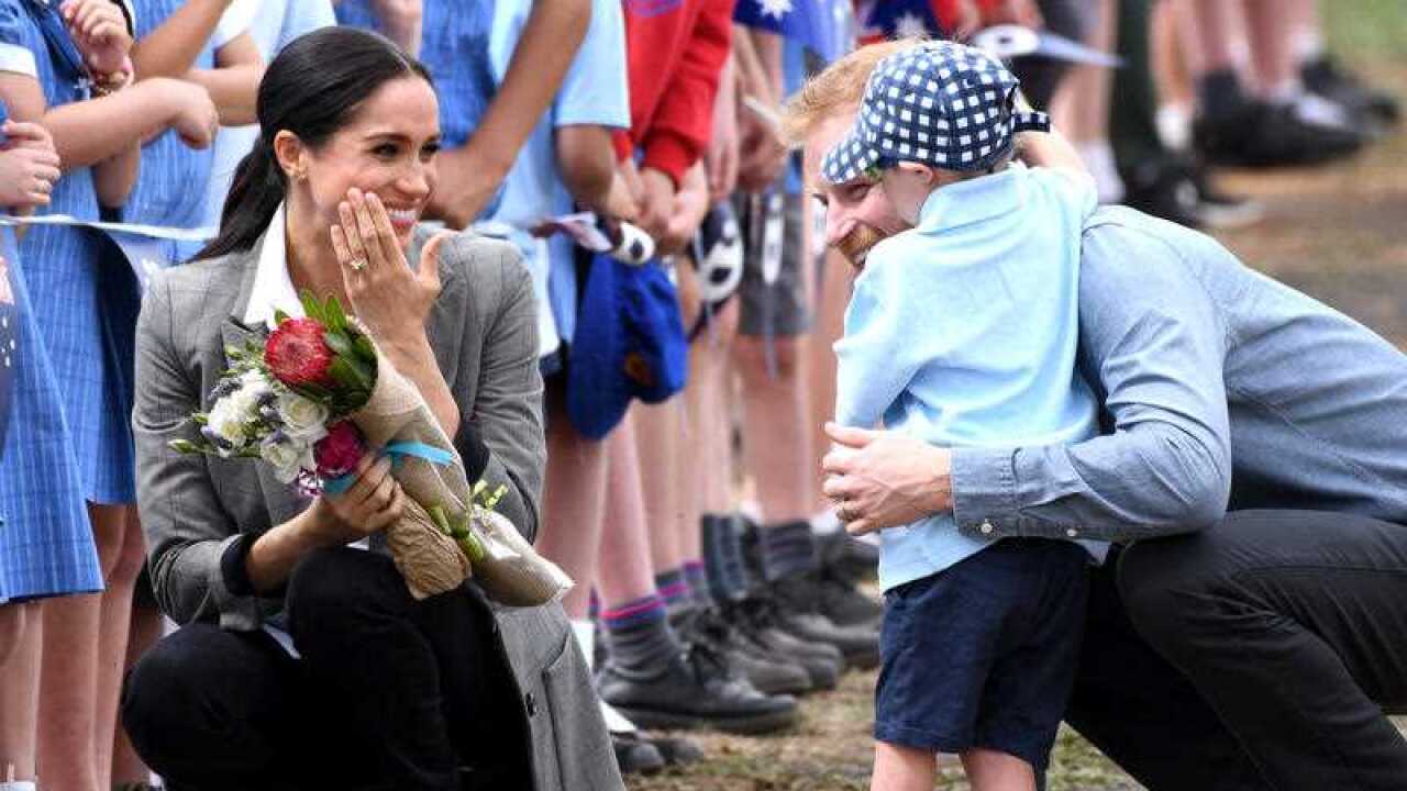 Prince Harry Duke of Sussex and Meghan Duchess of Sussex arrive at Dubbo Airport where they meet Luke Vincent, 5, from Buninyong Public School Kindergarten.