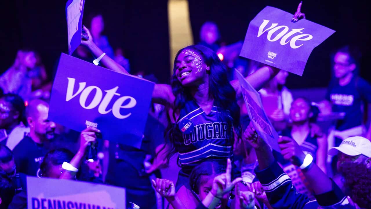 Members of the Harrisburg High School Marching Cougars cheer for Democratic presidential nominee Kamala Harris at a campaign rally in Harrisburg, Pennsylvania.