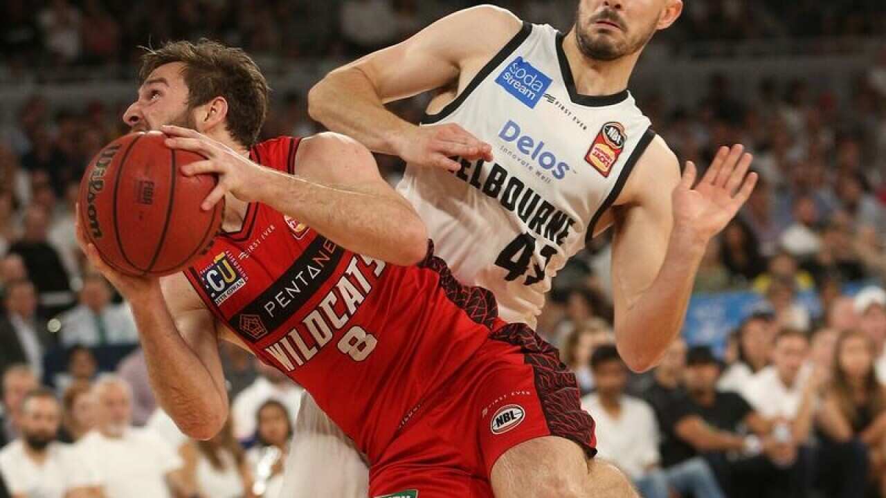 Melbourne United's Chris Goulding and Perth's Mitch Norton.