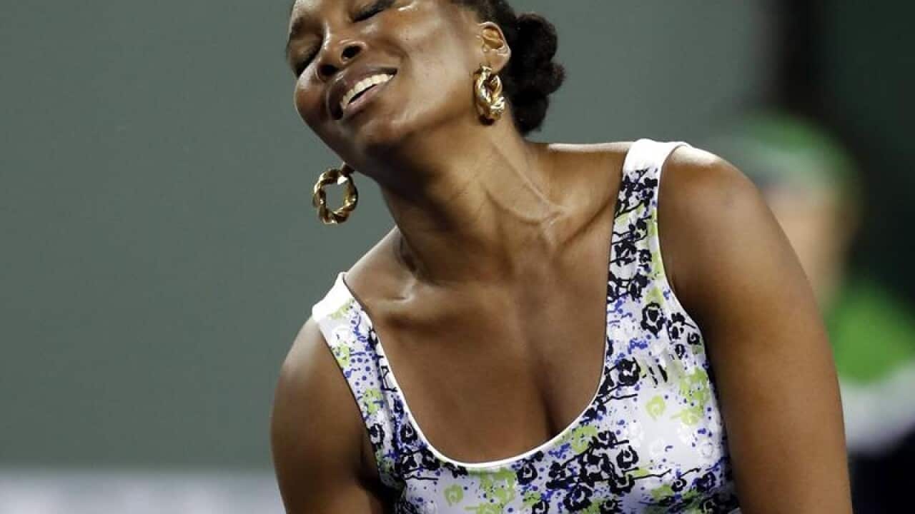 Venus Williams of the USA reacts while in action.