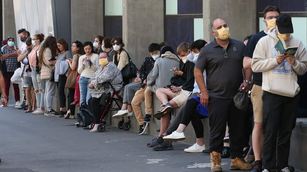 Patients line up at the Royal Melbourne Hospital for coronavirus testing.