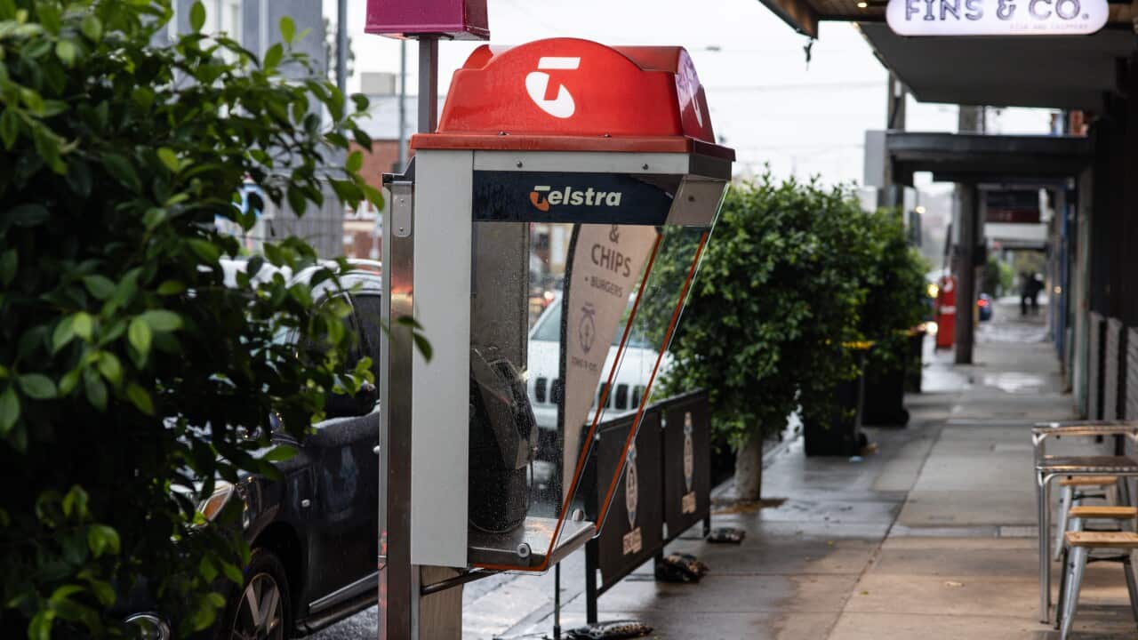 A payphone on a footpath.
