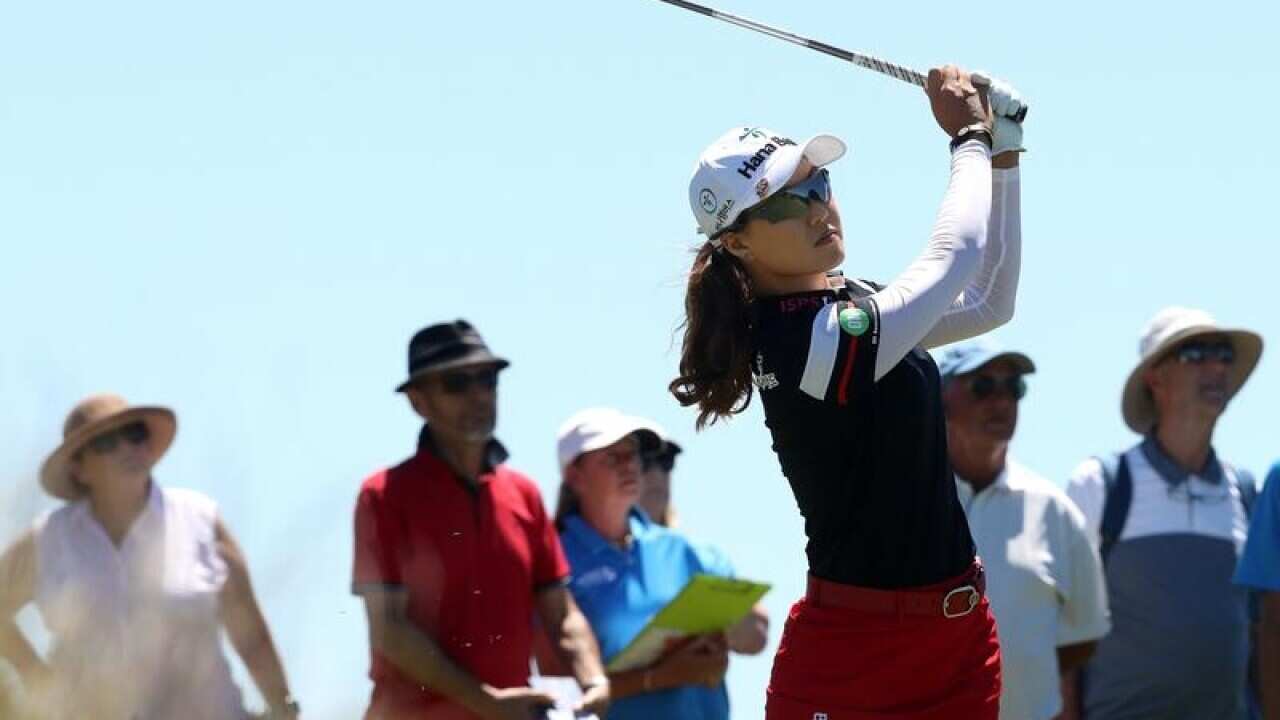 Overnight leader Minjee Lee plays an iron on the sixth tee.