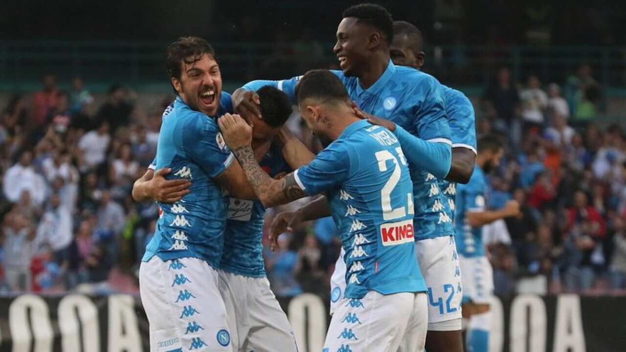 Napoli's Adam Ounas (2-L) celebrates with teammates scoring the 1-0 lead during the Italian Serie A soccer match between SSC Napoli and US Sassuolo at the San Paolo Stadium