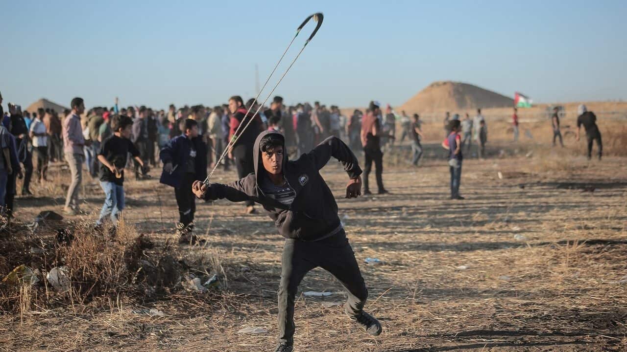 Palestinian protesters clash with Israeli troops in May.