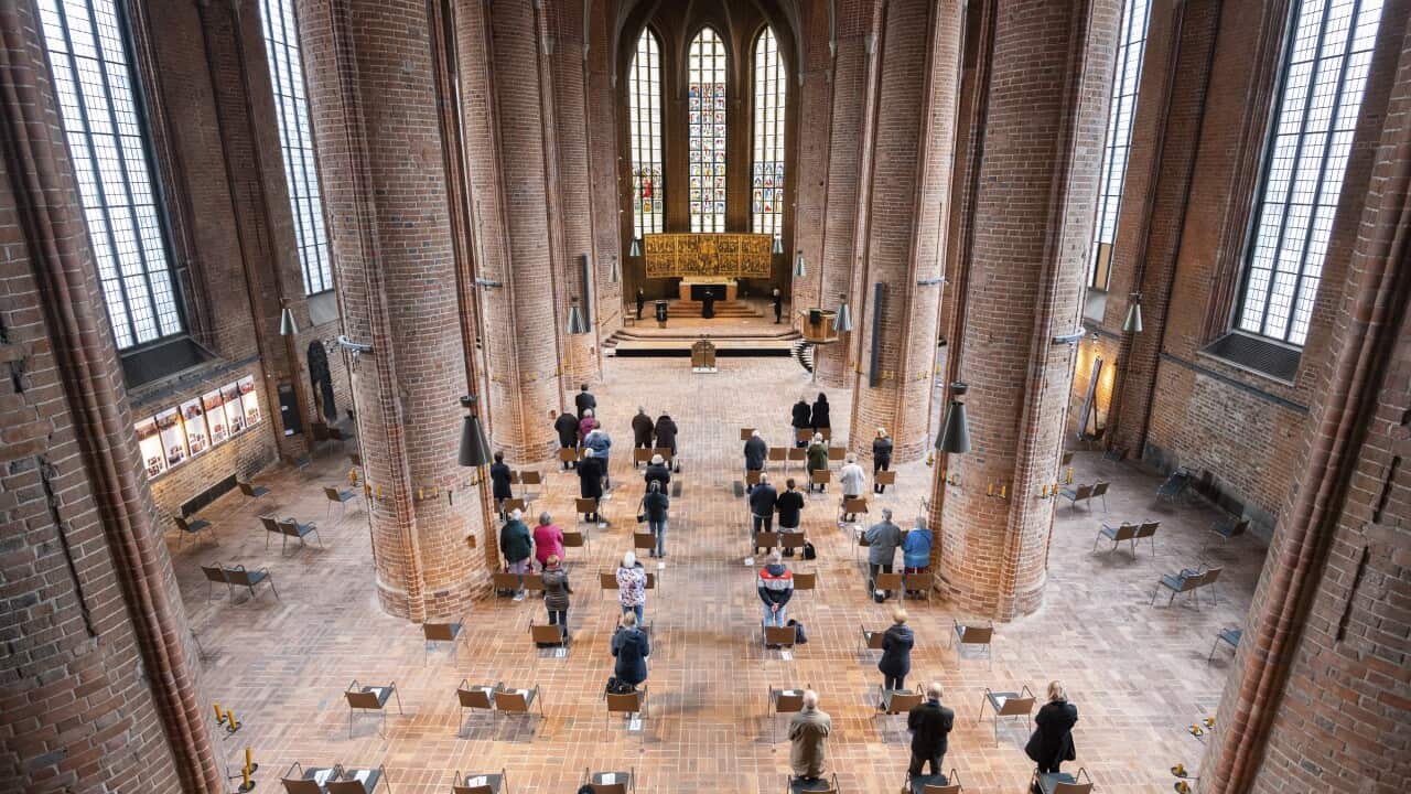Worshippers celebrate a Good Friday service at the Marktkirche on Hanover, Germany, Friday, 2 April, 2021.