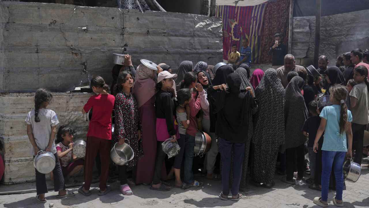 A group of Palestinians lining up for food in Gaza