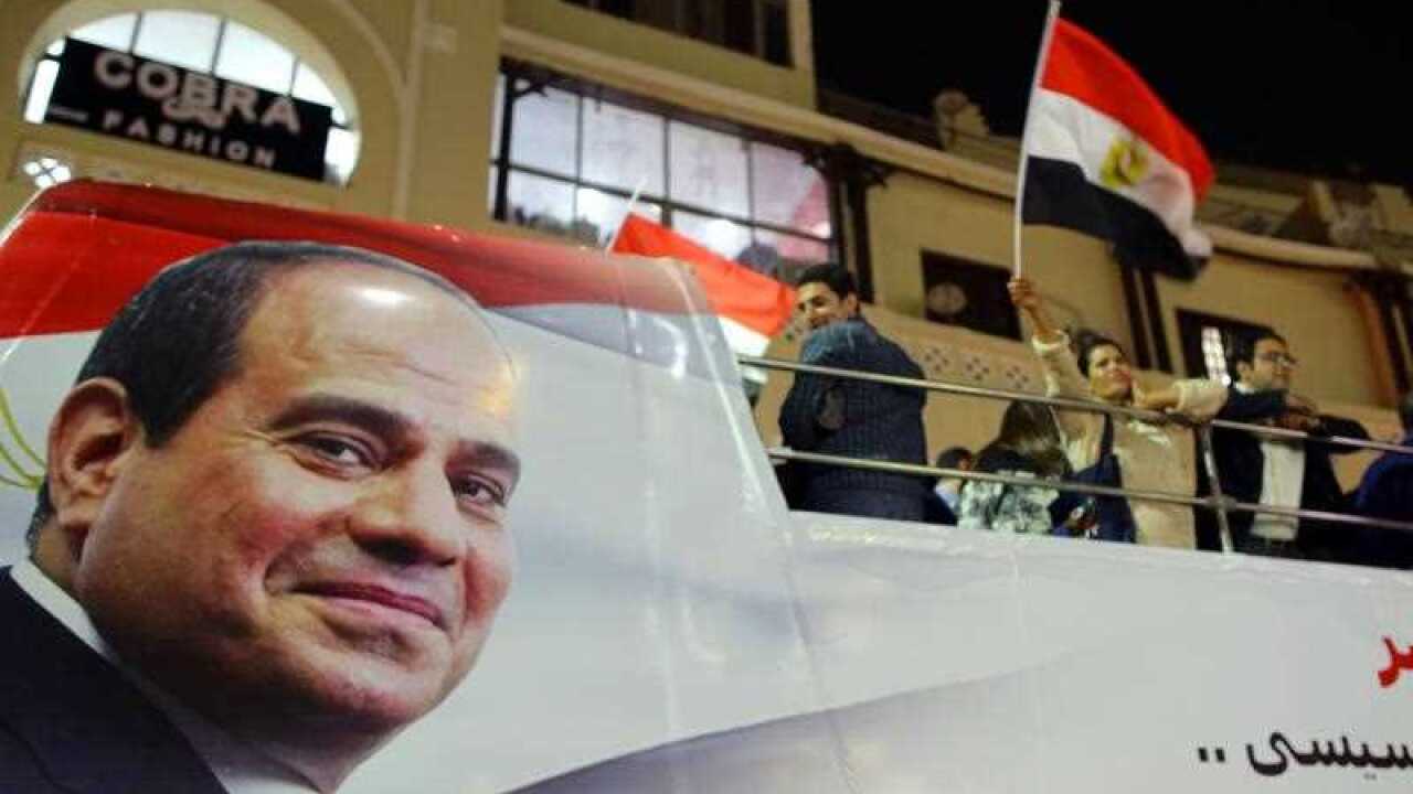 Supporters of Egyptian President Abdel Fattah al-Sisi celebrate in Heliopolis after the presidential election results were announced.