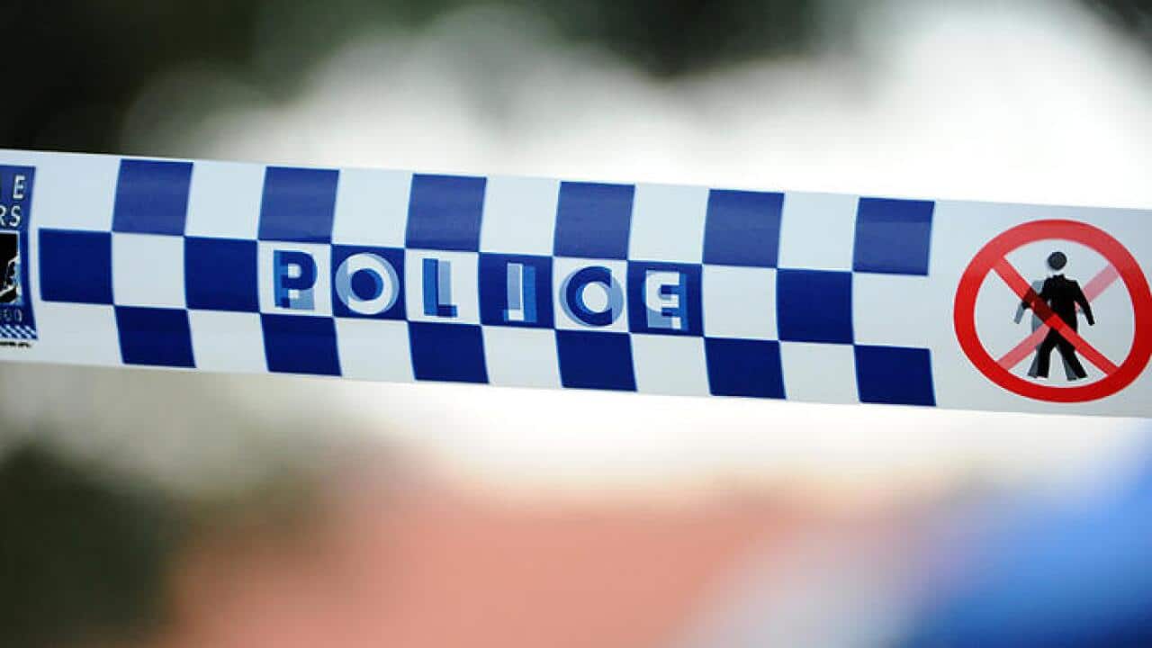 Police tape outside a home where a six week-old girl was found dead in a house in Newcastle, Friday, July 24, 2015. (AAP Image/Joel Carrett)