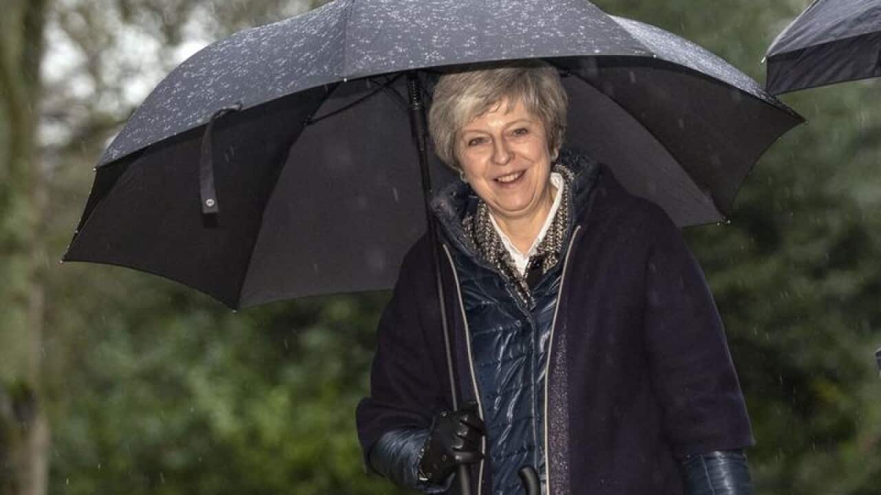Prime Minister Theresa May leaves after attending a church service