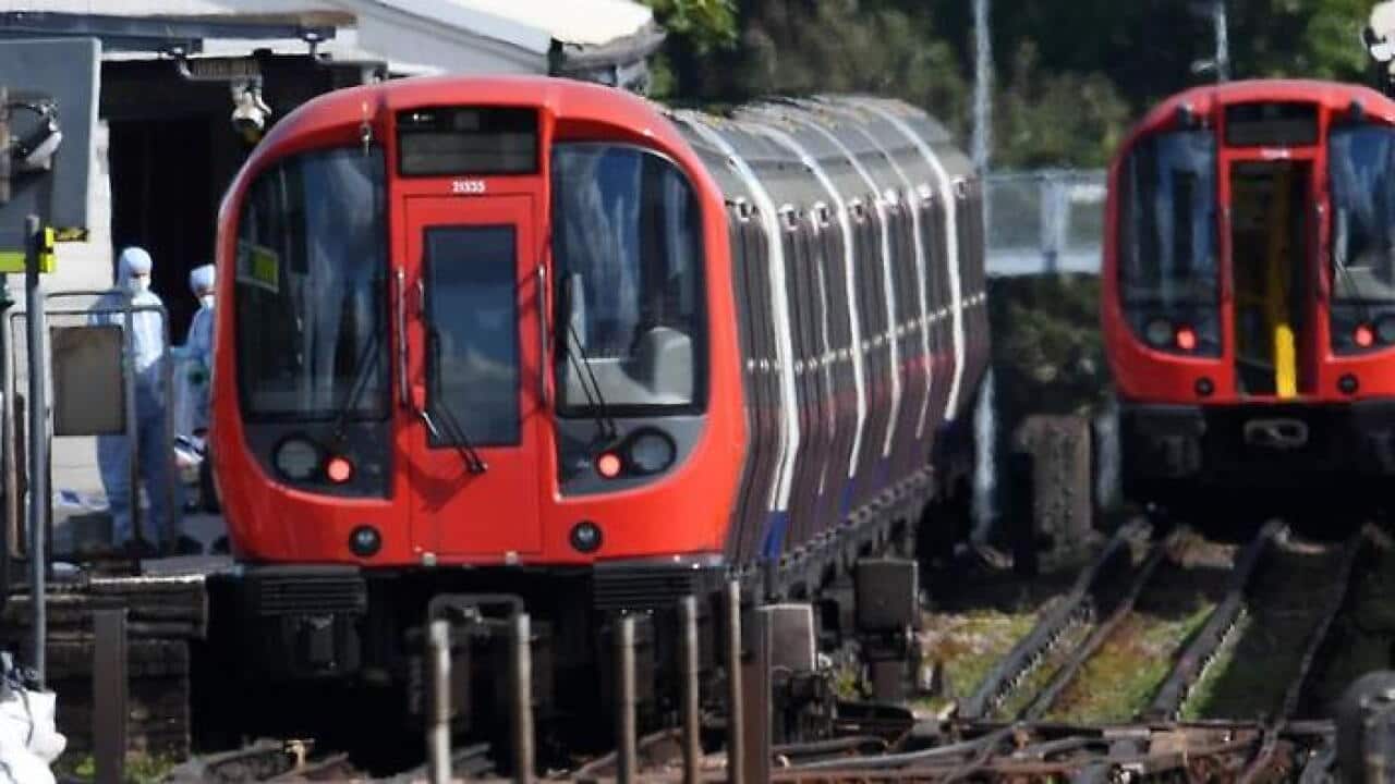 Forensic police at Parsons Green station in London where a device exploded on a packed train