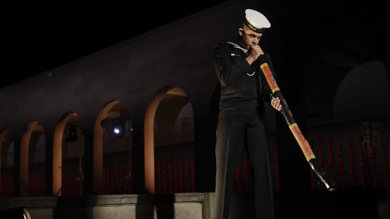 Seaman Lynton Robbins, Royal Australian Navy, plays the didgeridoo during Anzac Day Commemorative Service at the Australian War Memorial in Canberra, Saturday, April 25, 2020.(AAP Image/Courtesy of the Australian War Memorial, Sean Davey) NO ARCHIVING
