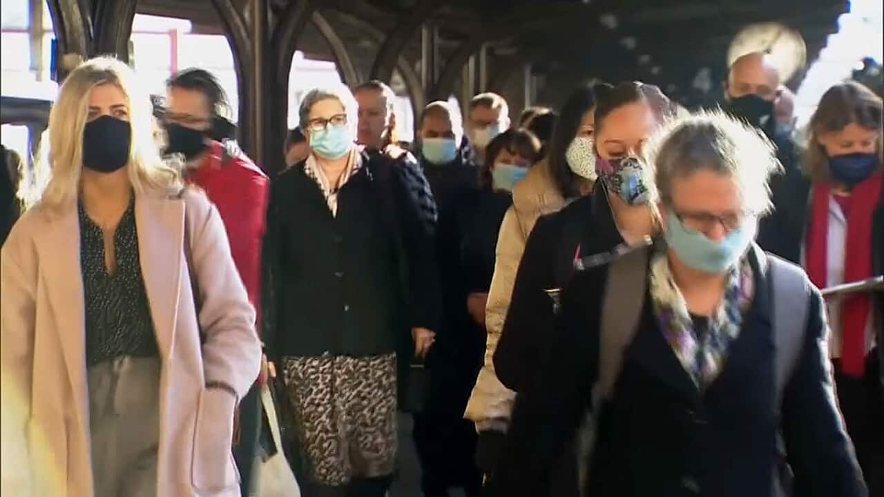 Aucklanders wearing masks at a central city railway station