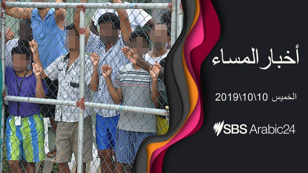 image of Asylum seekers staring at media from behind a fence at the Manus Island