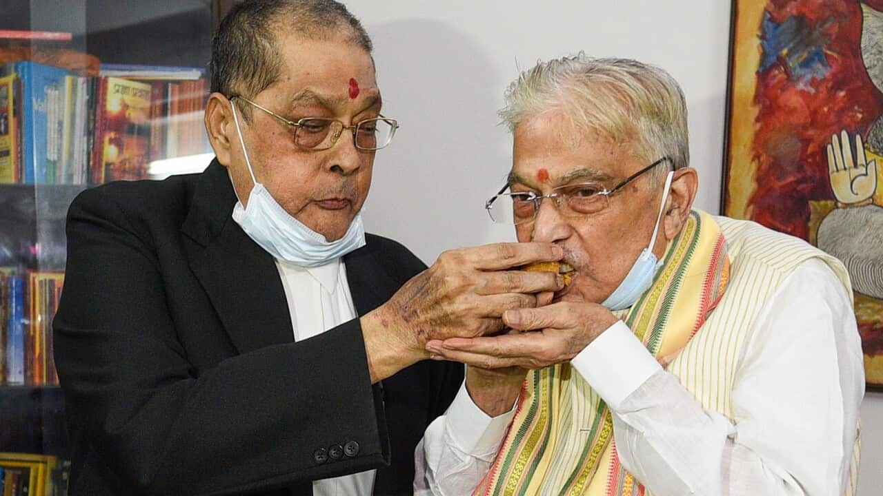 Senior Advocate Mahipal Ahluwali feeds sweets to BJP leader Murli Manohar Joshi after a special CBI court's verdict in Lucknow acquitted Joshi in the Babri Masjid Demolition Case, on September 30, 2020 in New Delhi, India.