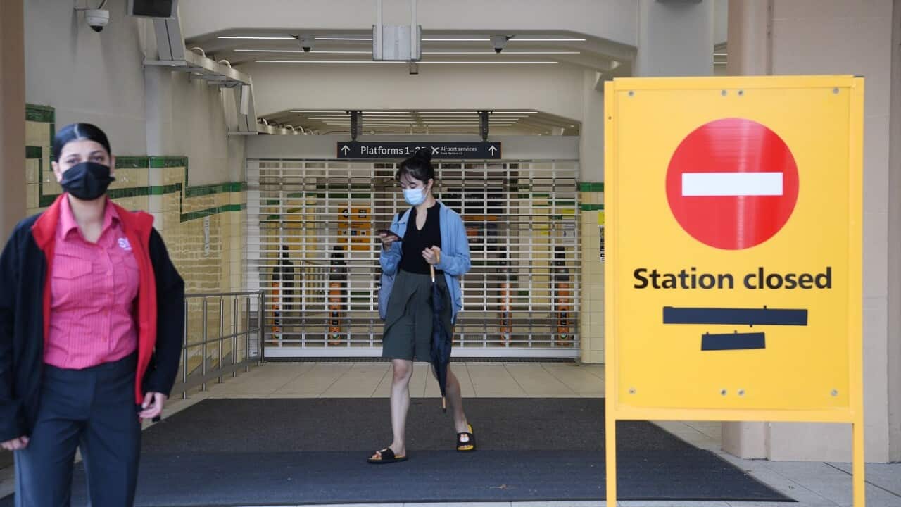 Commuters arrive at the closed Central Station during the shutdown of Sydney's train network in Sydney, February 21, 2022.