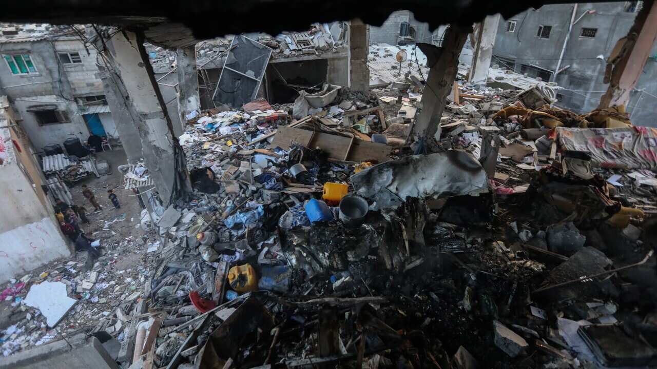 A collapsed and damaged building in Gaza.