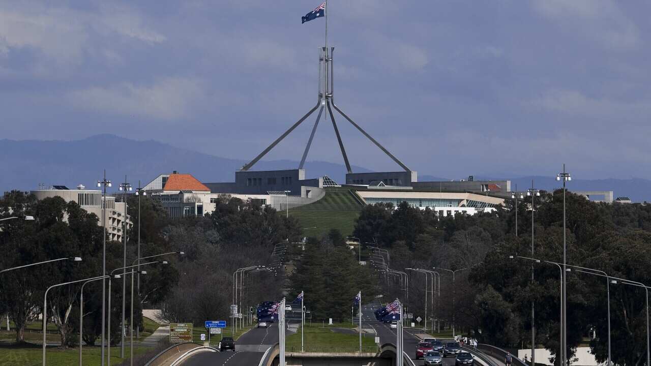 Few cars are seen crossing Kings Avenue bridge leading to Parliament House in Canberra as the city's coronavirus lockdown drags on.