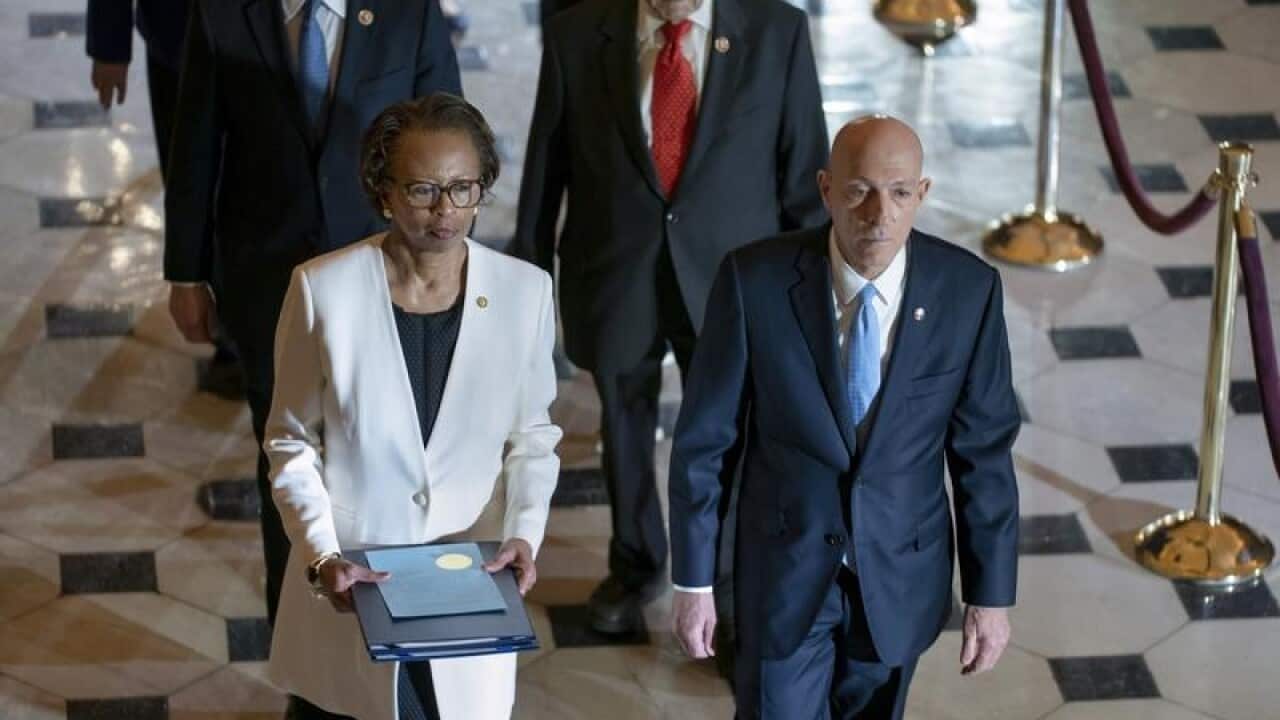 The articles of impeachment being delivered to the Senate.