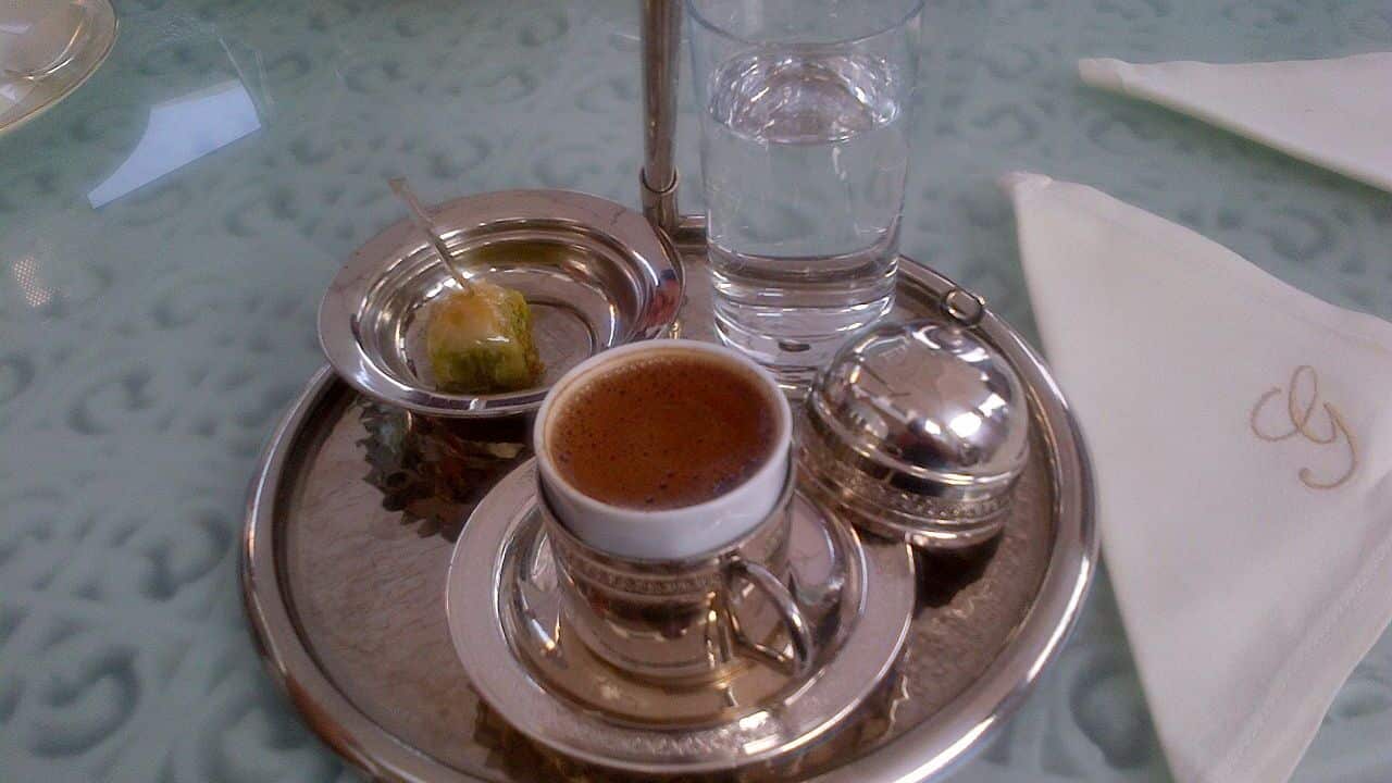An elegant Turkish coffee presentation, with a small piece of baklava, at Istanbul.