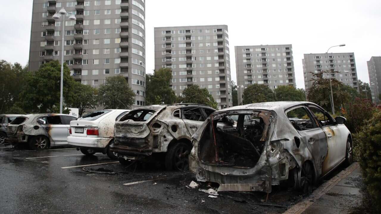 Burned out cars at Frolunda Square in Gothenburg, Sweden, 14 August 2018.