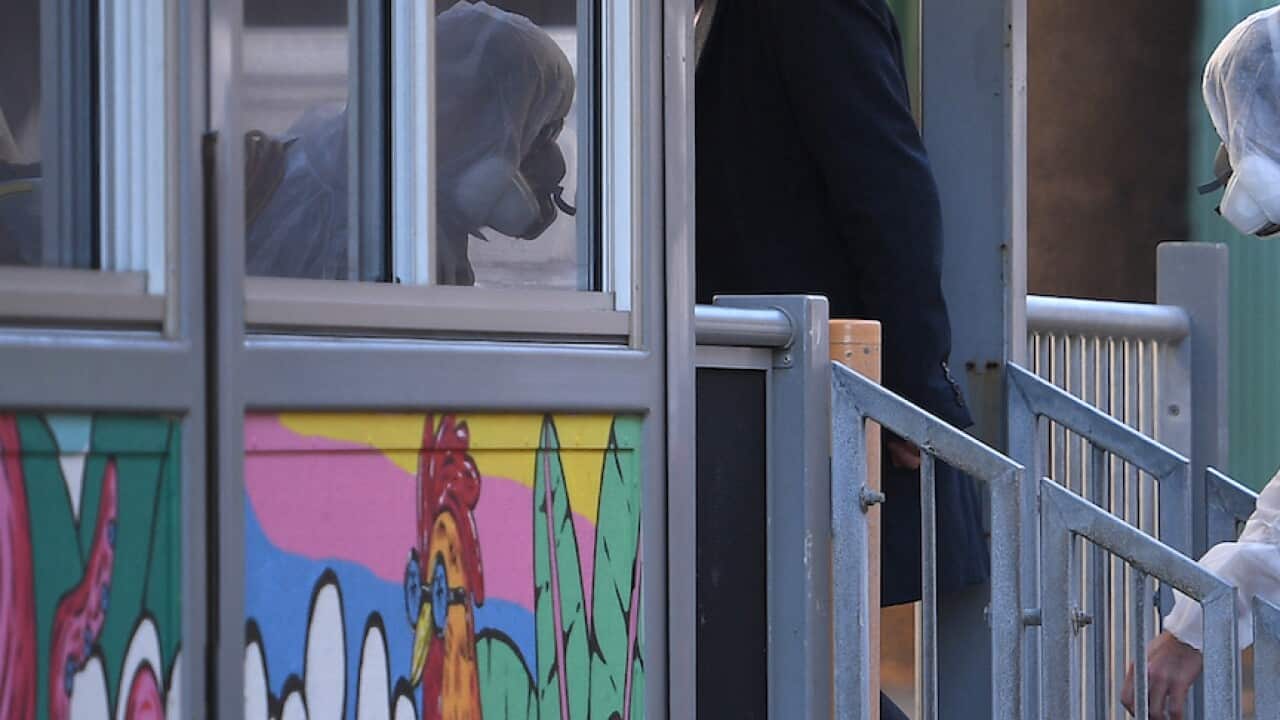 Cleaners are seen at Bondi Beach public school, in Bondi, Sydney, Tuesday, August 10, 2021.
