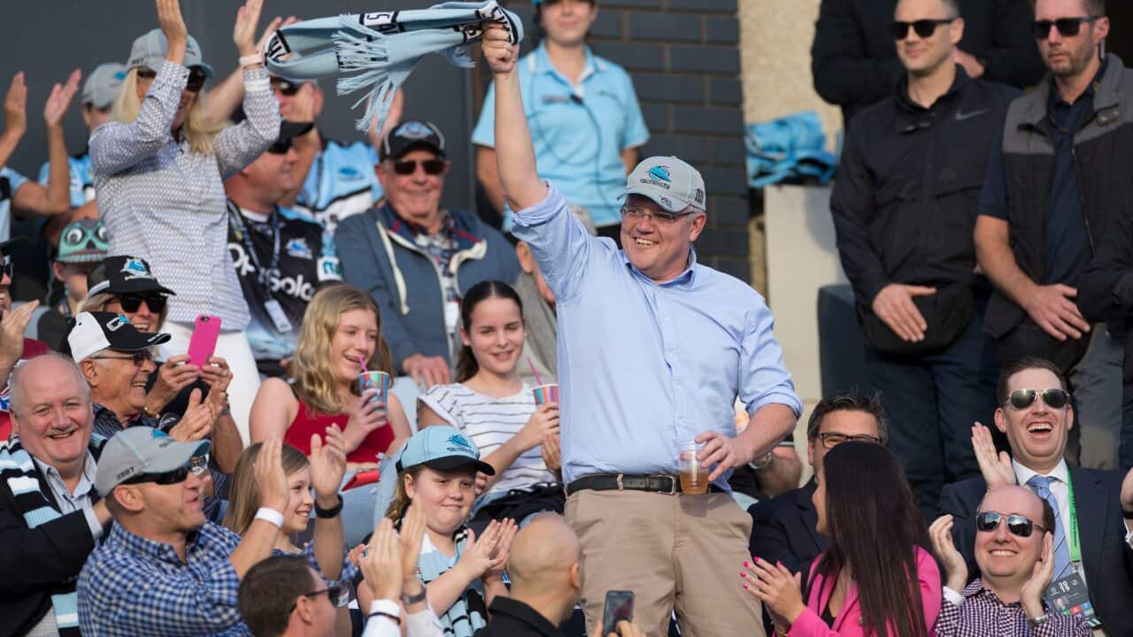 Newly reelected Prime Minister Scott Morrison waves to the crowd during the Round 10 NRL match between the Cronulla Sharks and the Manly Sea Eagles
