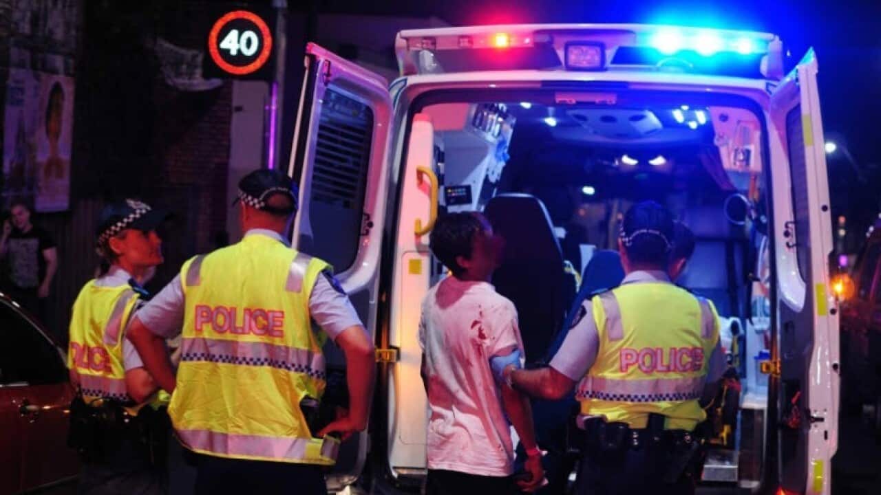 Stock Image: Queensland Police and ambulance personnel.