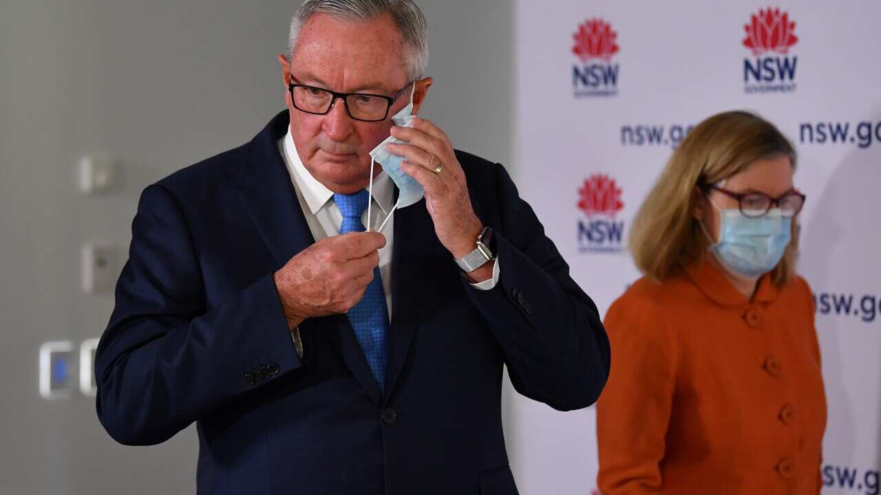 NSW Health Minister Brad Hazzard and Chief Health Officer Dr Kerry Chant arrive at Sunday's press conference.