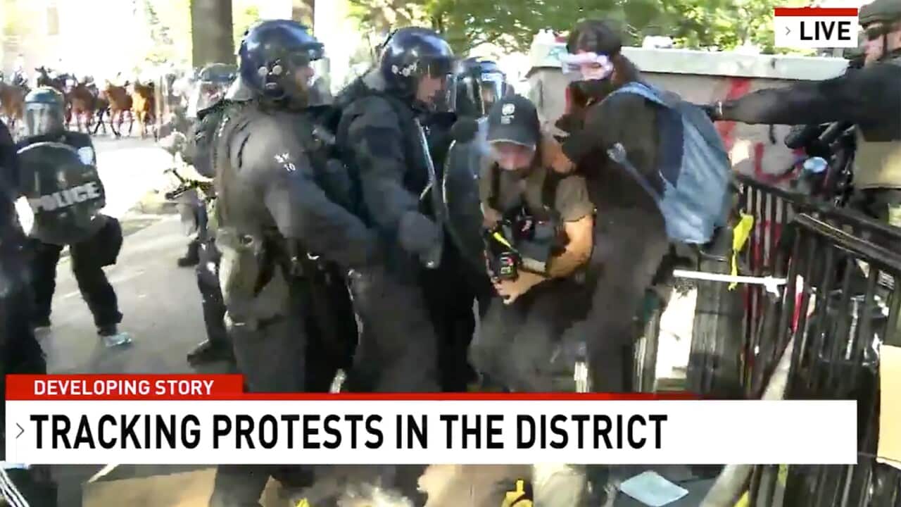 Network Seven cameraman Tim Myers and reporter Amelia Brace as they were assaulted by police officers while covering protests in Washington, USA.