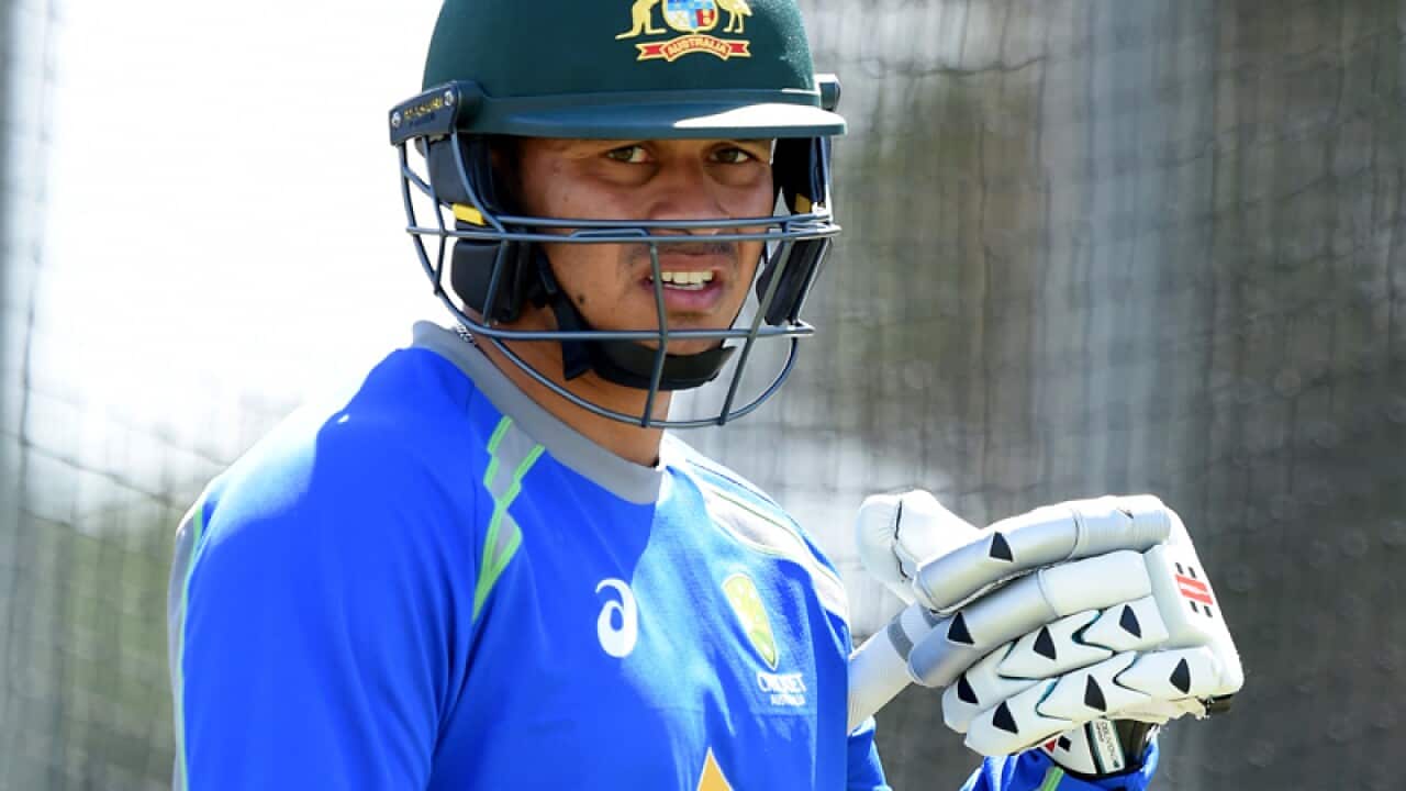 Usman Khawaja looks on during a net session