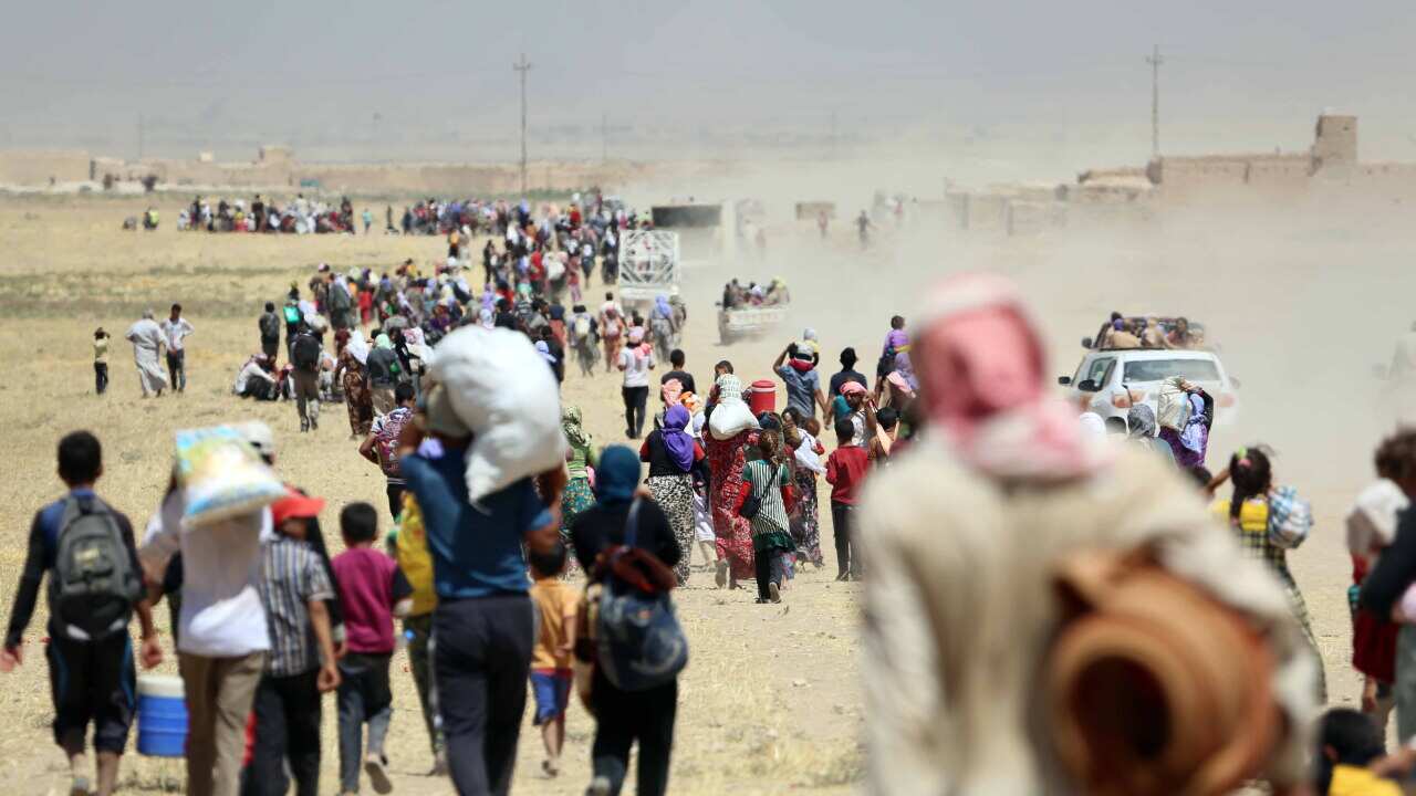 Yezidis trapped in the Sinjar mountains are rescued