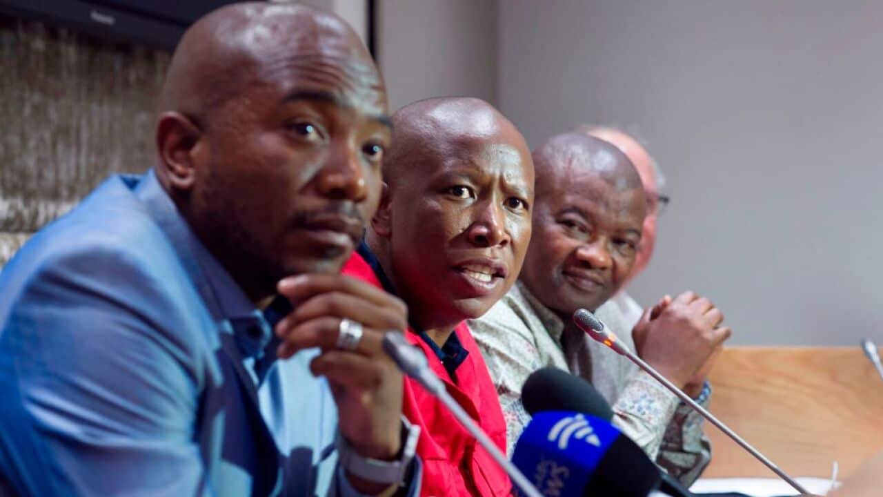 Economic Freedom Fighters (EFF) party leader Julius Malema (2nd L) speaks flanked by Democratic Alliance (DA) party leader Mmusi Maimane (L), United Democratic Movement leader Bantu Holomisa (2nd R) and Corne Mulder (R) of the Freedom Front Plus (FF+), as