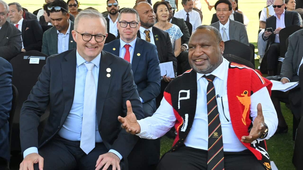 Prime Minister Anthony Albanese and Papua New Guinea’s Prime Minister James Marape seated next to each other.