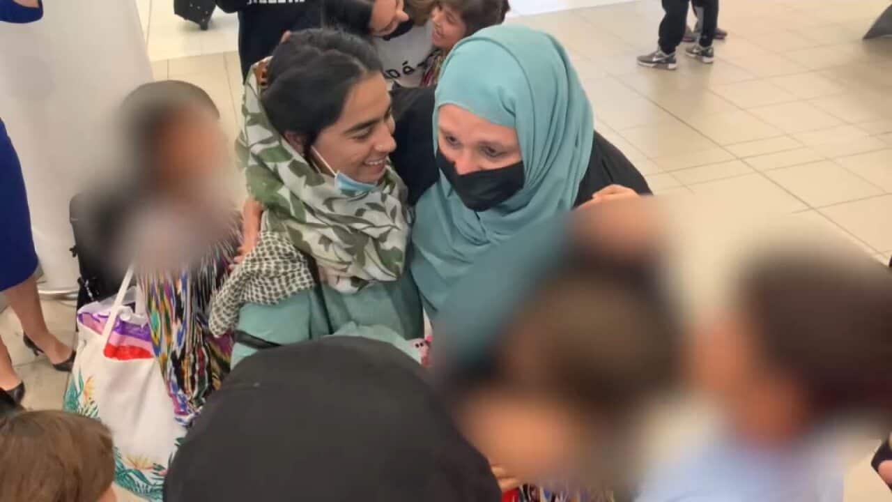 Mahboba Rawi with Latifa (right) and some of the other orphans