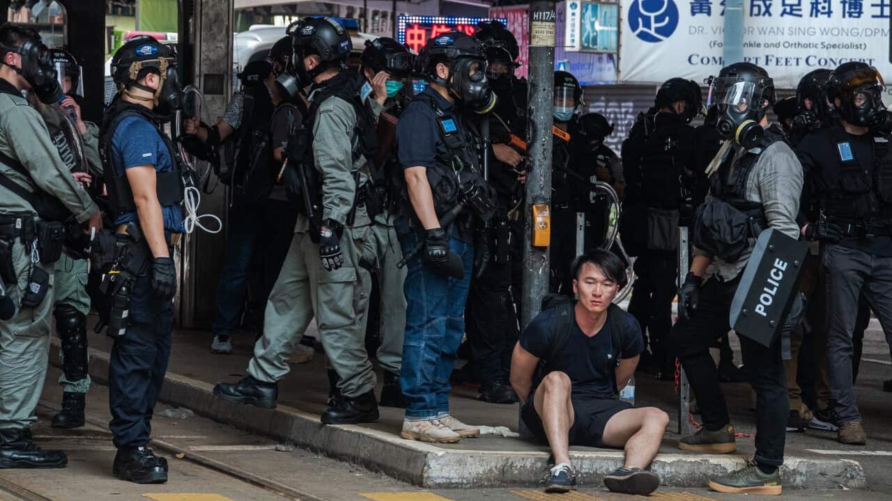 A protester is arrested by the riot police in Hong Kong.