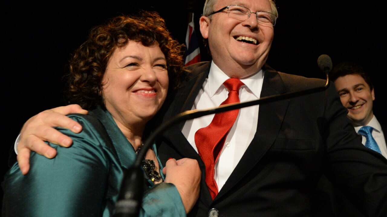 Former Prime Minister Kevin Rudd hugs his wife Therese Rein