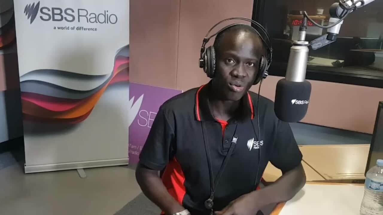 Augustino Akuar Dut in SBS Radio studio in Sydney