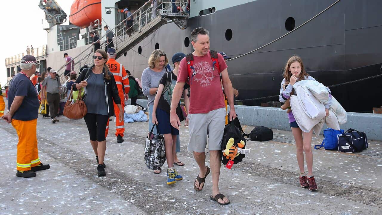 The navy ship MV Sycamore arriving at the port of Hastings with evacuees from Mallacoota.