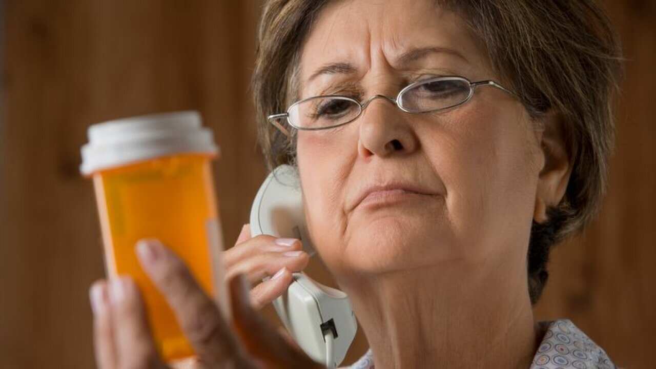 Senior Hispanic woman calling in prescription