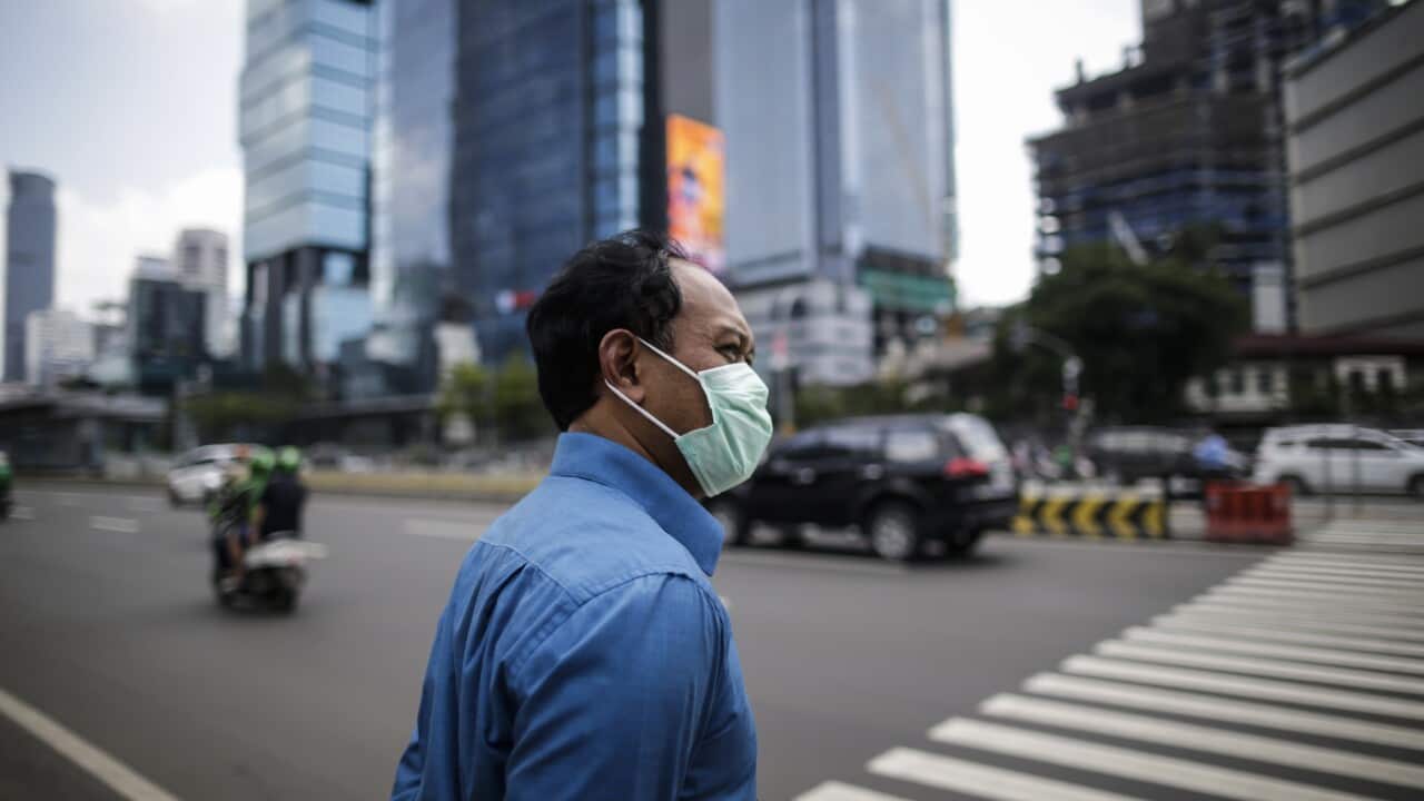 An Indonesian man wears a protective face mask in Jakarta